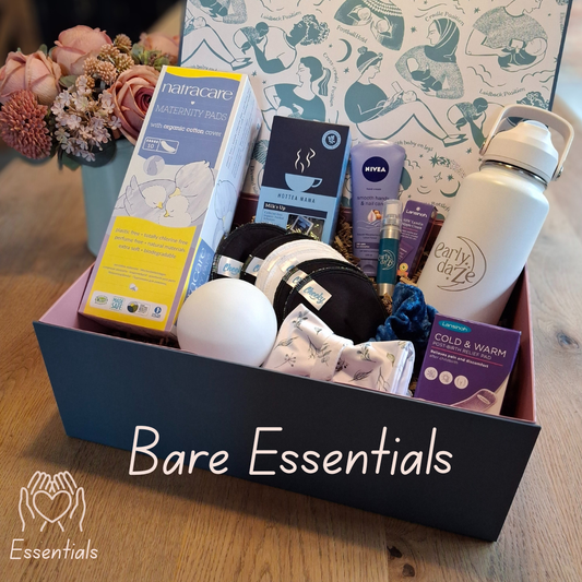 Gift Box with the title Bare Essentials with various items including a water bottle and skincare products on a wooden surface