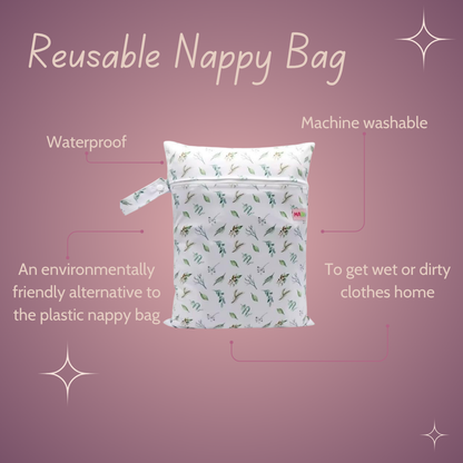 Reusable nappy bag with features on a pink background